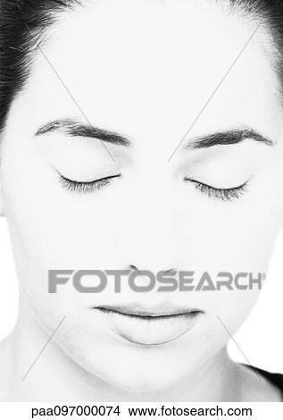 Picture - Woman's face with closed eyes, close-up, B&W. Fotosearch