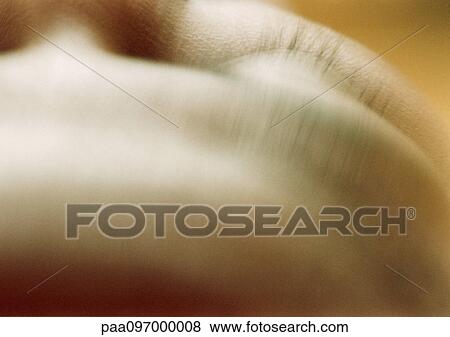 Stock Photo - Woman's forehead, elevated view, close-up. Fotosearch