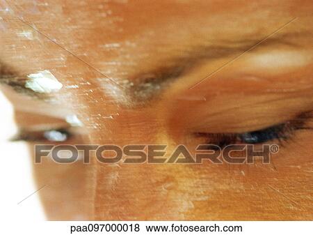 Stock Photo - Woman's wet face, partial view, close-up. Fotosearch