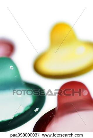 Colored condoms, close-up View Large Photo Image Stock Photo - Colored condoms, close-up. Fotosearch