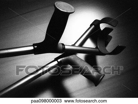 Stock Image - Crutches, close-up, B&W. Fotosearch