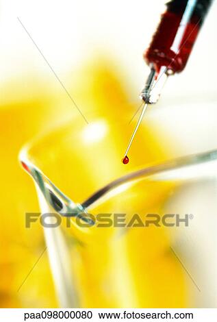Syringe above glass flask, close-up View Large Photo Image Stock Image - Syringe above glass flask, close-up. Fotosearch