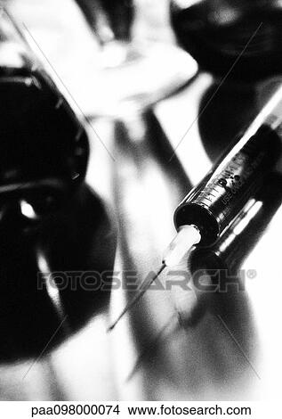 Picture - Syringe, close-up, B&W. Fotosearch