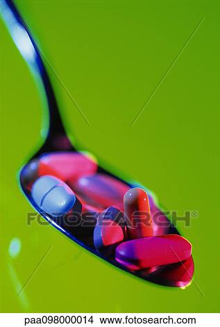 Various pills in spoon, close-up View Large Photo Image Picture - Various pills in spoon, close-up. Fotosearch
