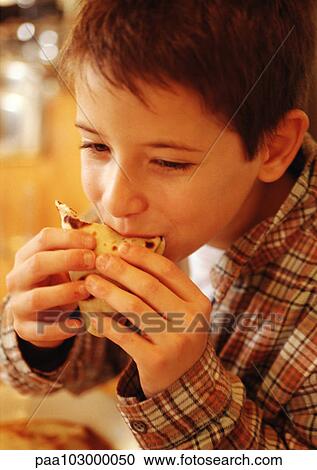 Child eating crepe, close-up View Large Photo Image Stock Image - Child eating crepe, close-up. Fotosearch