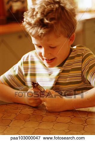 Stock Photo - Child using nutcracker, close-up. Fotosearch