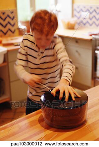Child using salad spinner in kitchen, blurred motion View Large Photo Image Stock Image - Child using salad spinner in kitchen, blurred motion. Fotosearch