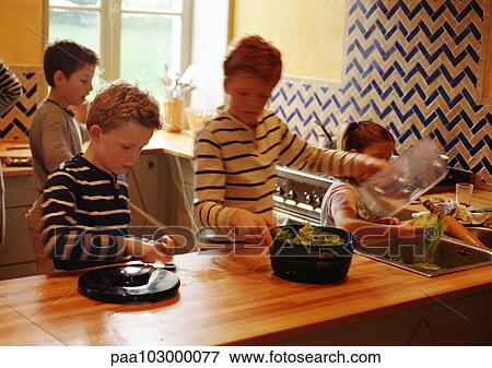 Children in kitchen, blurred View Large Photo Image Stock Photo - Children in kitchen, blurred. Fotosearch