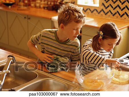 Stock Photo - Children in kitchen. Fotosearch