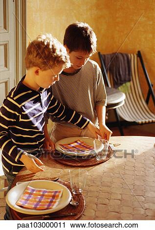 Children setting table Stock Image | paa103000011 | Fotosearch