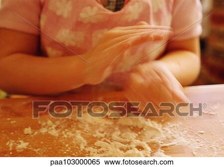 Hands kneading dough, close-up, blurred View Large Photo Image Stock Photography - Hands kneading dough, close-up, blurred. Fotosearch