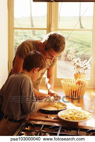 Man and child making apple pie View Large Photo Image Stock Image - Man and child making apple pie. Fotosearch