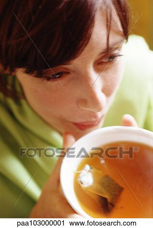Woman holding bowl of tea, close-up View Large Photo Image Stock Image - Woman holding bowl of tea, close-up. Fotosearch