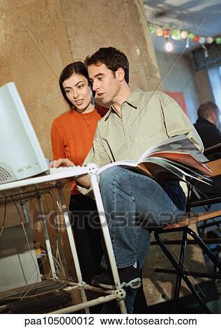 Man and woman looking at computer View Large Photo Image Stock Image - Man and woman looking at computer. Fotosearch