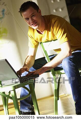 Man using laptop computer, portrait View Large Photo Image Stock Photography - Man using laptop computer, portrait. Fotosearch