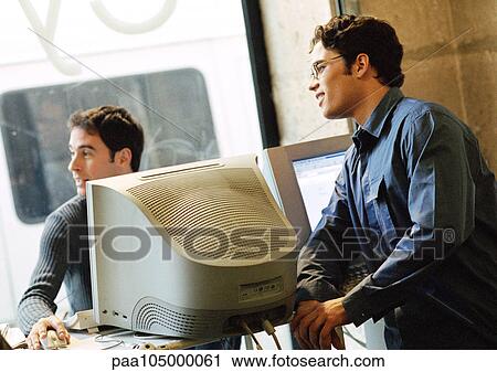 Two men in cyber cafe View Large Photo Image Stock Image - Two men in cyber cafe. Fotosearch