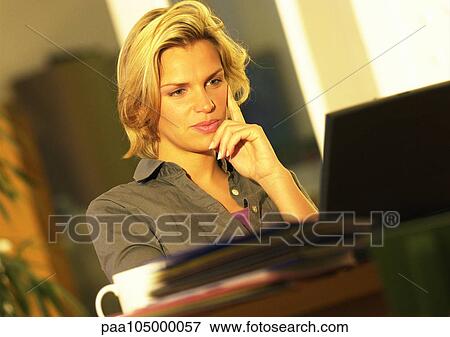 Woman looking at laptop computer View Large Photo Image Stock Photo - Woman looking at laptop computer. Fotosearch