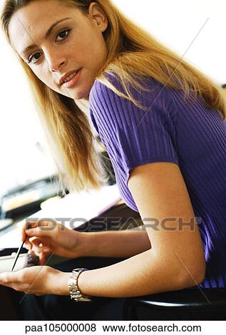 Woman using hand held computer, portrait View Large Photo Image Stock Photo - Woman using hand held computer, portrait. Fotosearch