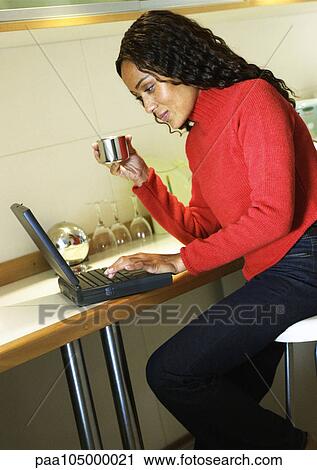 Woman working on laptop computer View Large Photo Image Stock Image - Woman working on laptop computer. Fotosearch
