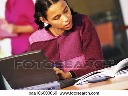 Woman working with laptop computer View Large Photo Image Stock Photo - Woman working with laptop computer. Fotosearch