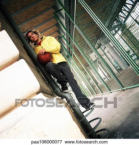 Man holding basketball View Large Photo Image Stock Photo - Man holding basketball. Fotosearch