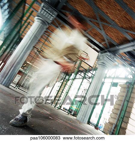 Man in front of basketball goal, blurred motion View Large Photo Image Stock Image - Man in front of basketball goal, blurred motion. Fotosearch