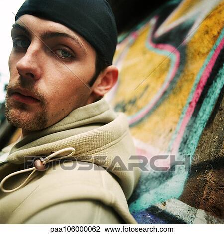 Young man looking into camera, close-up, portrait View Large Photo Image Stock Image - Young man looking into camera, close-up, portrait. Fotosearch