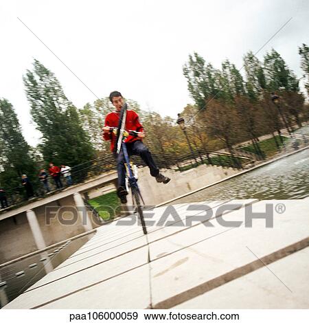 Young man on bike View Large Photo Image Stock Photo - Young man on bike. Fotosearch