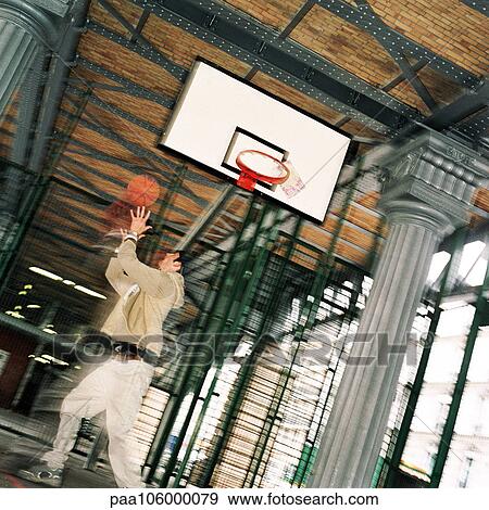 Young man playing basketball, blurred View Large Photo Image Stock Photo - Young man playing basketball, blurred. Fotosearch