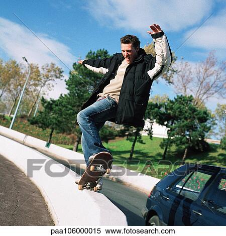 Stock Photography - Young man skateboarding. Fotosearch