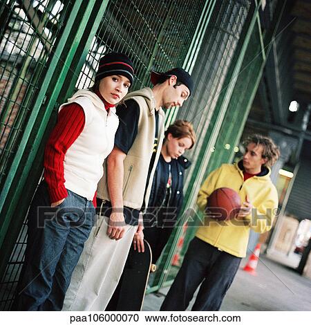 Young people, one young man holding basketball View Large Photo Image Stock Image - Young people, one young man holding basketball. Fotosearch
