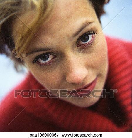 Young woman looking into camera, portrait View Large Photo Image Stock Photo - Young woman looking into camera, portrait. Fotosearch