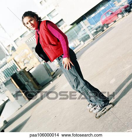 Young woman on inline skates, portrait View Large Photo Image Picture - Young woman on inline skates, portrait. Fotosearch