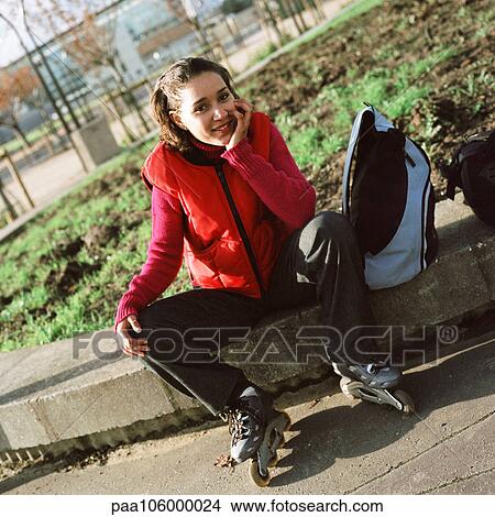 Young woman wearing inline skates, portrait View Large Photo Image Picture - Young woman wearing inline skates, portrait. Fotosearch