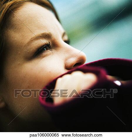 Young woman with hands over mouth, side view, close-up View Large Photo Image Stock Photography - Young woman with hands over mouth, side view, close-up. Fotosearch