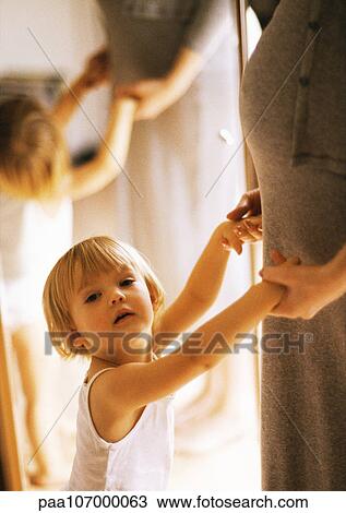 Child holding pregnant woman's hands, portrait View Large Photo Image Stock Image - Child holding pregnant woman's hands, portrait. Fotosearch