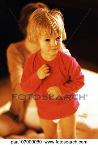 Child standing in front of pregnant mother View Large Photo Image Stock Image - Child standing in front of pregnant mother. Fotosearch