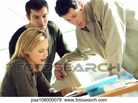 Stock Photo - Businness people working in office. Fotosearch