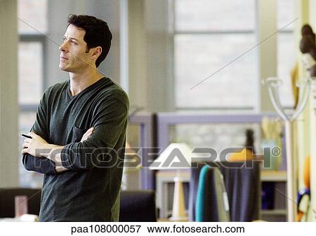 Man standing with arms crossed View Large Photo Image Stock Photo - Man standing with arms crossed. Fotosearch