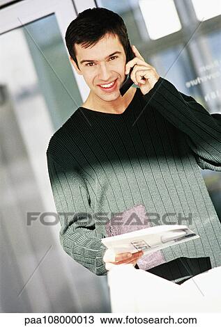 Man using cell phone, portrait View Large Photo Image Stock Image - Man using cell phone, portrait. Fotosearch
