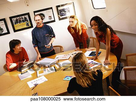 People in conference room, gathered around table View Large Photo Image Stock Photography - People in conference room, gathered around table. Fotosearch