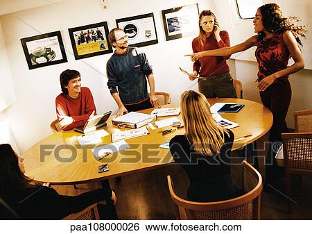 People in conference room, woman pointing finger View Large Photo Image Stock Photograph - People in conference room, woman pointing finger. Fotosearch