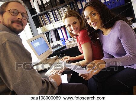 Stock Photo - People in office, smiling, portrait. Fotosearch