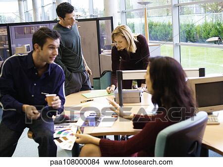 Picture - People talking in office. Fotosearch