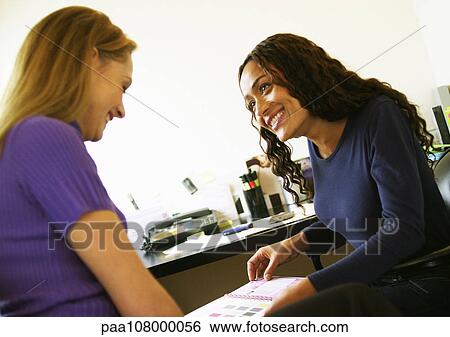 Women working in office, smiling View Large Photo Image Stock Photograph - Women working in office, smiling. Fotosearch