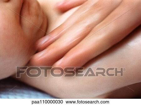 Adult fingers on baby's chest, close-up View Large Photo Image Stock Image - Adult fingers on baby's chest, close-up. Fotosearch