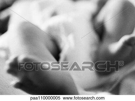 Stock Photography - Baby's legs, close-up, b&w. Fotosearch