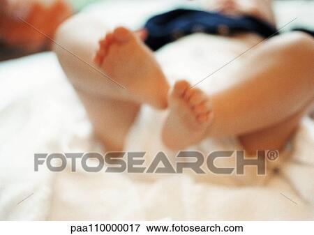 Stock Photo - Baby's legs, close-up. Fotosearch