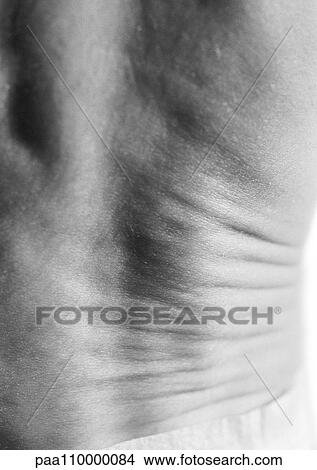 Folds in baby's back, close-up, b&w View Large Photo Image Picture - Folds in baby's back, close-up, b&w. Fotosearch