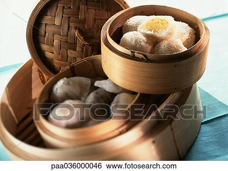 Asian food in bamboo steamers, close-up View Large Photo Image Stock Photograph - Asian food in bamboo steamers, close-up. Fotosearch